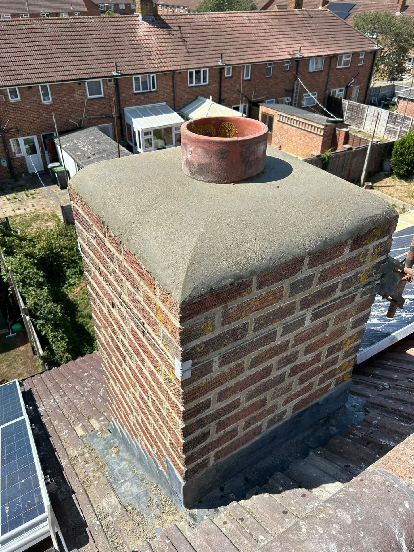 Rebuilt chimney with fresh cement flaunching and a new pot fitted