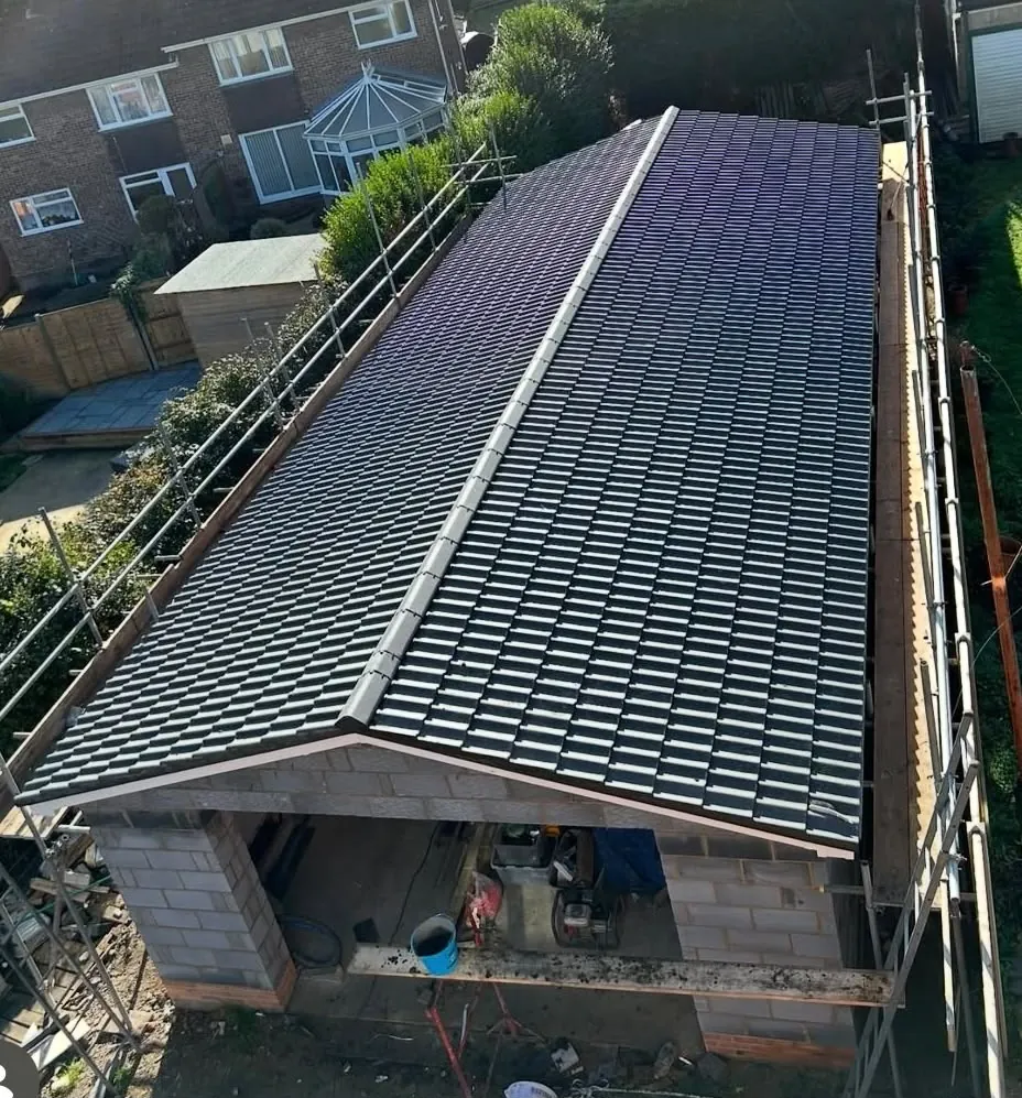 Completed tiled roof covering on an outbuilding, photographed from above after a re-roof