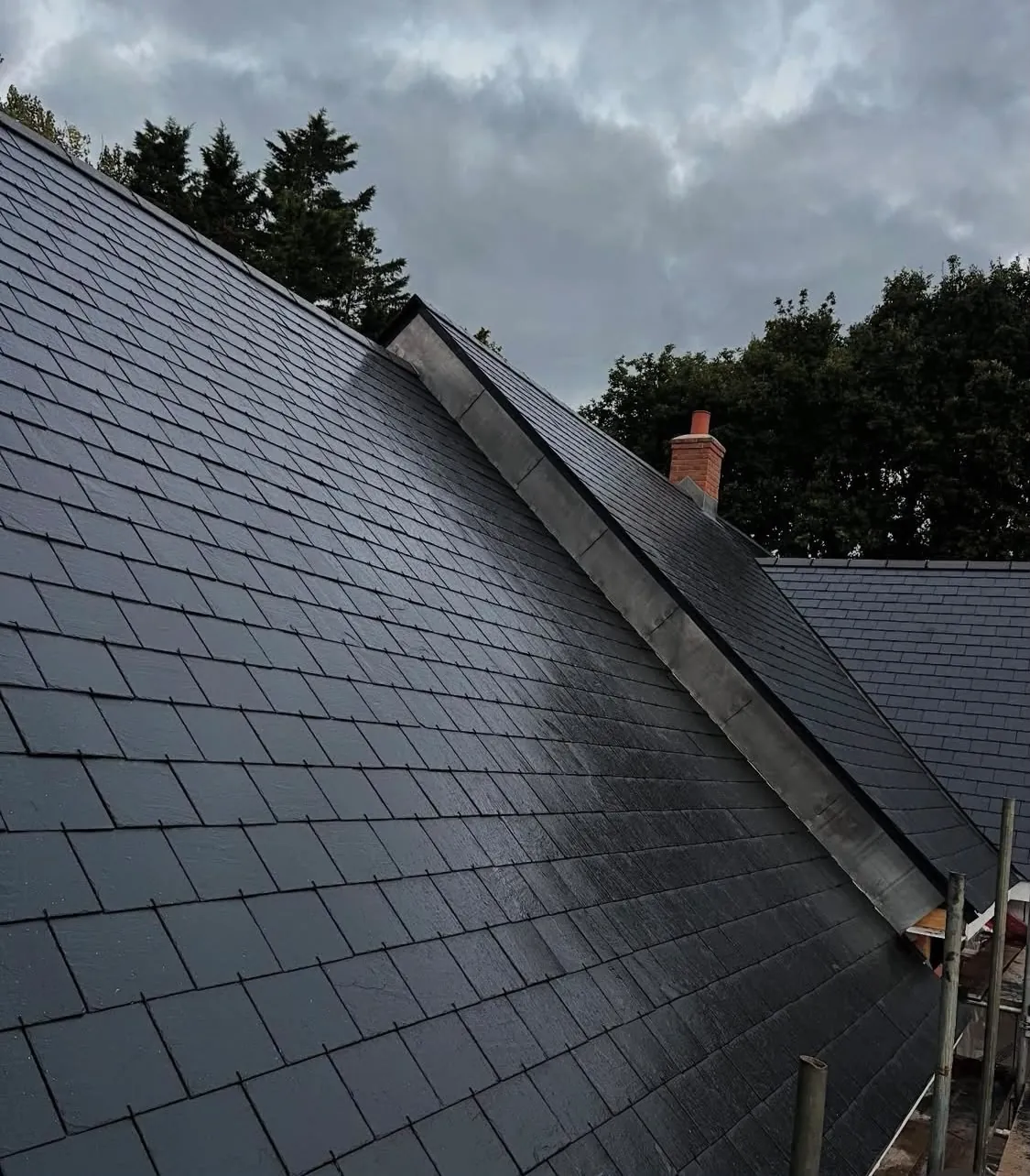 Completed slate roof with hand-dressed lead hip detail by S&S Roofing in Hampshire