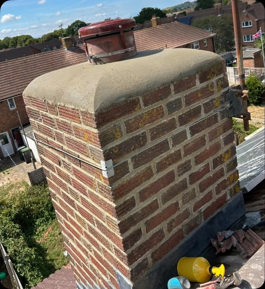 Rebuilt chimney stack with new sand-and-cement crown and capped pot, Hampshire